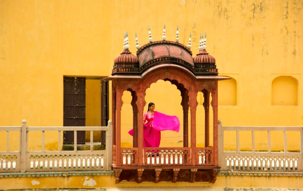 Woman in Hawa Mahal and enjoying holiday at Jaipur, Rajasthan, India.