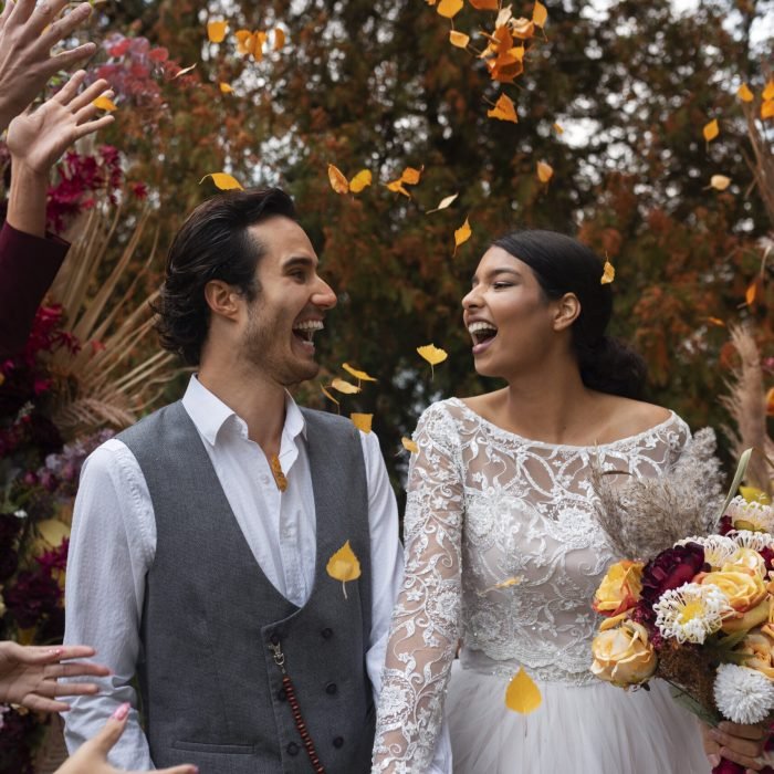 front-view-smiley-couple-wedding
